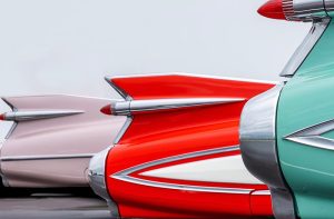 A single car model shown in multiple different colors, symbolizing the common myth that car color affects the price of auto insurance.