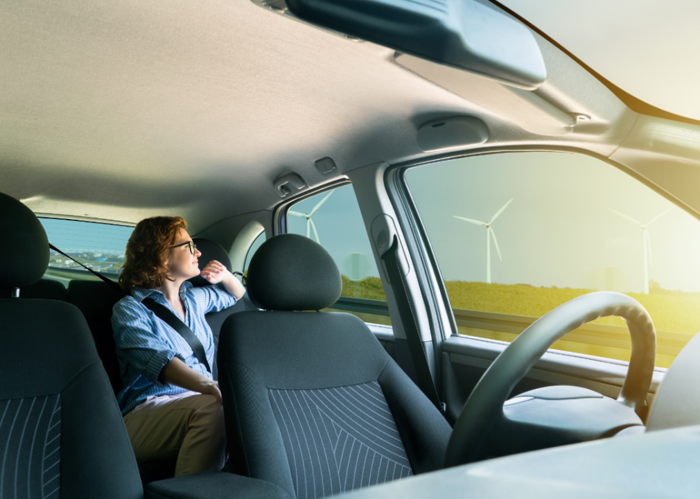 female backseat passenger in driverless car level 5 automation