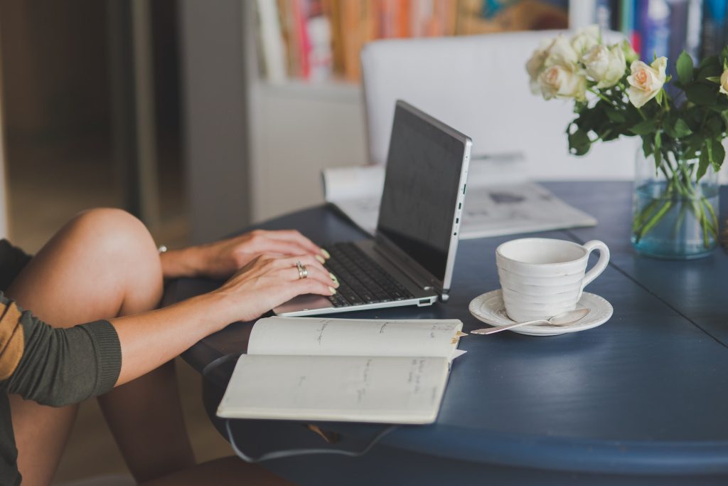 woman checking car insurance quotes on a laptop computer