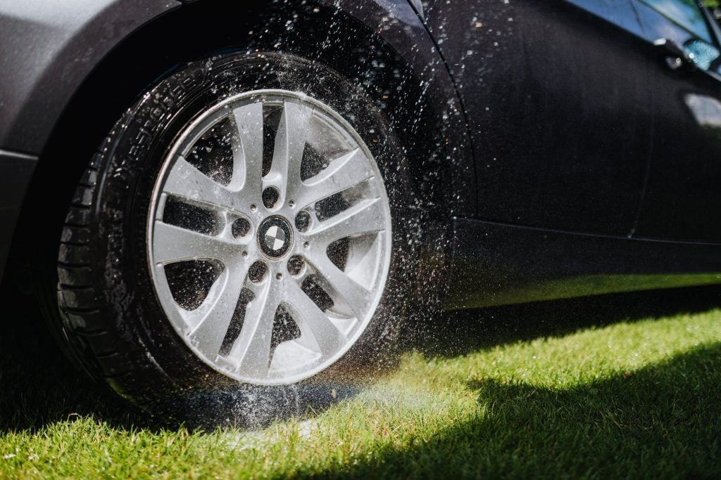 car wheel and tire being washed