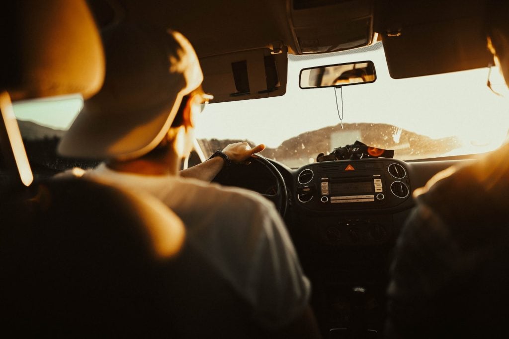 driver with sun in windshield