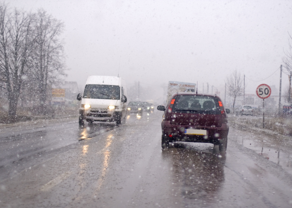 vehicles on road in snow