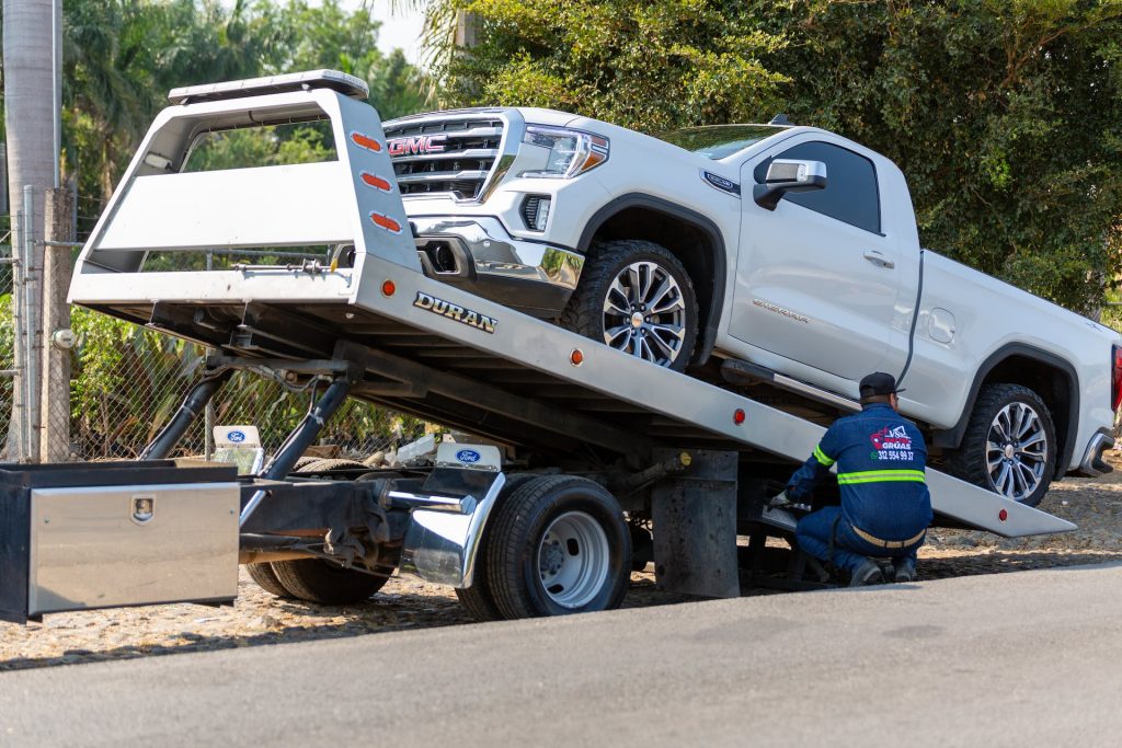 pickup truck being loaded onto a tow truck