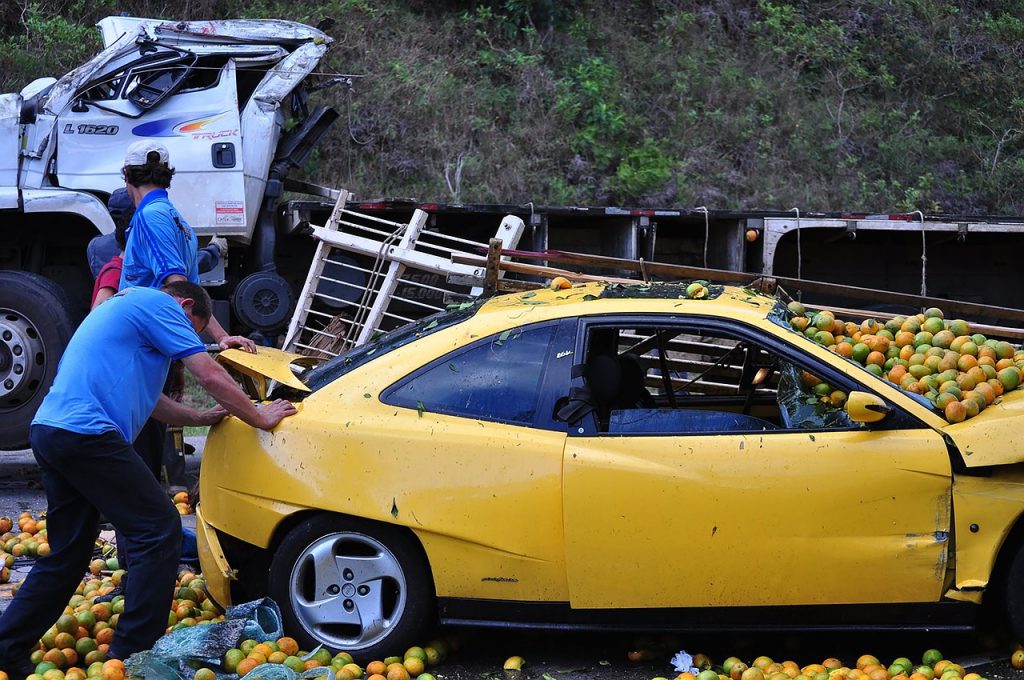Car Accident with truck and oranges.