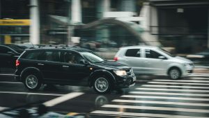 Cars driving in heavy traffic, representing a common scenario where modern safety features help prevent accidents.