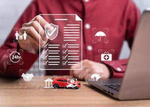 A man's hand selecting an option on a digital screen, symbolizing the process of choosing car insurance coverage and avoiding being overinsured.