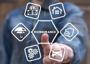 A hand tapping a "reinsurance" button on a smartphone screen, symbolizing how a complex financial process affects a consumer's car insurance policy.