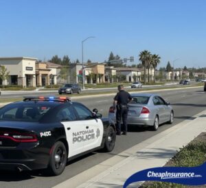 Police vehicle on patrol in Natomas, CA, illustrating the context of SR22 insurance and local driving regulations.